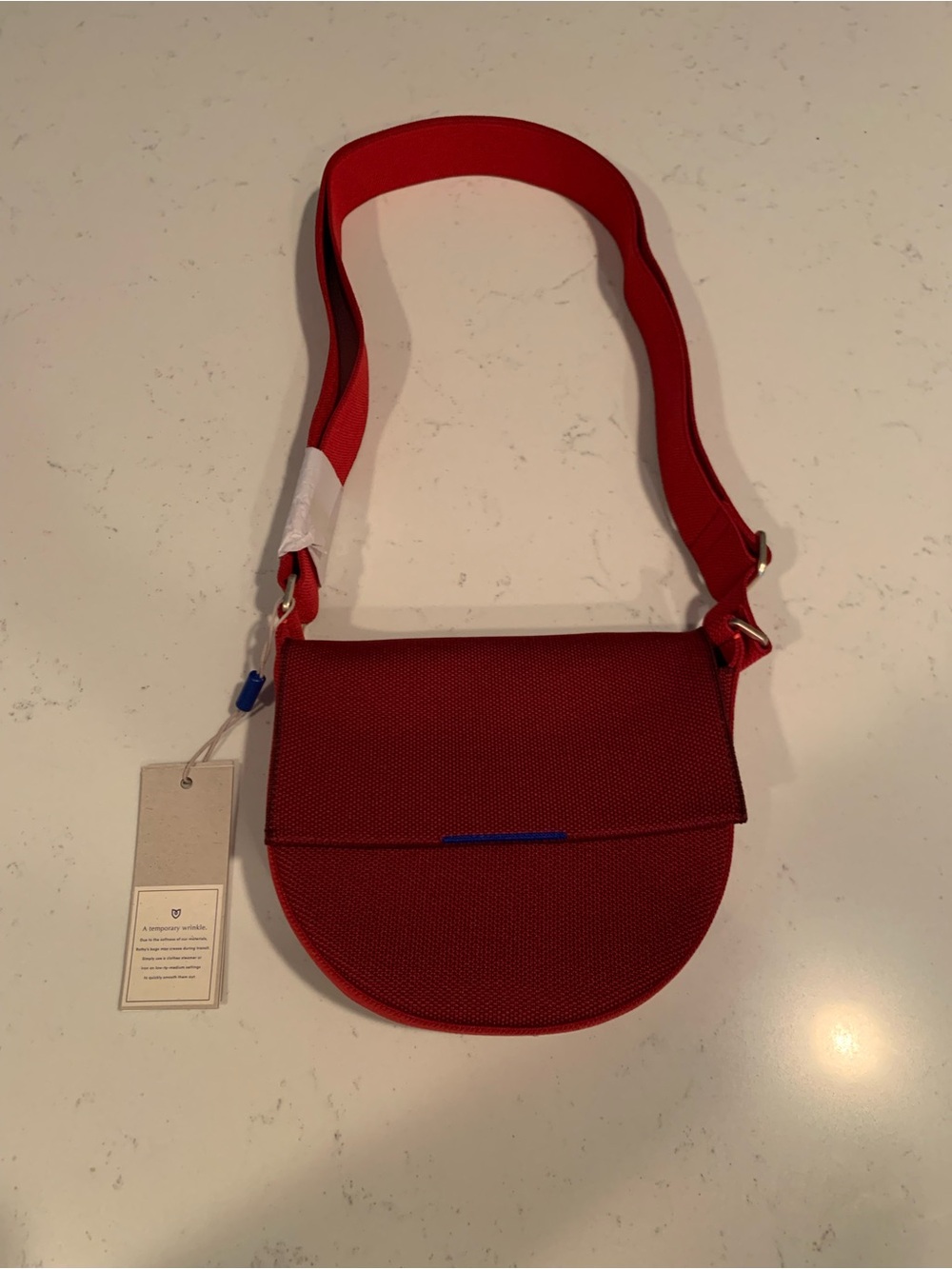 Rothy’s ruby red saddle bag NWT